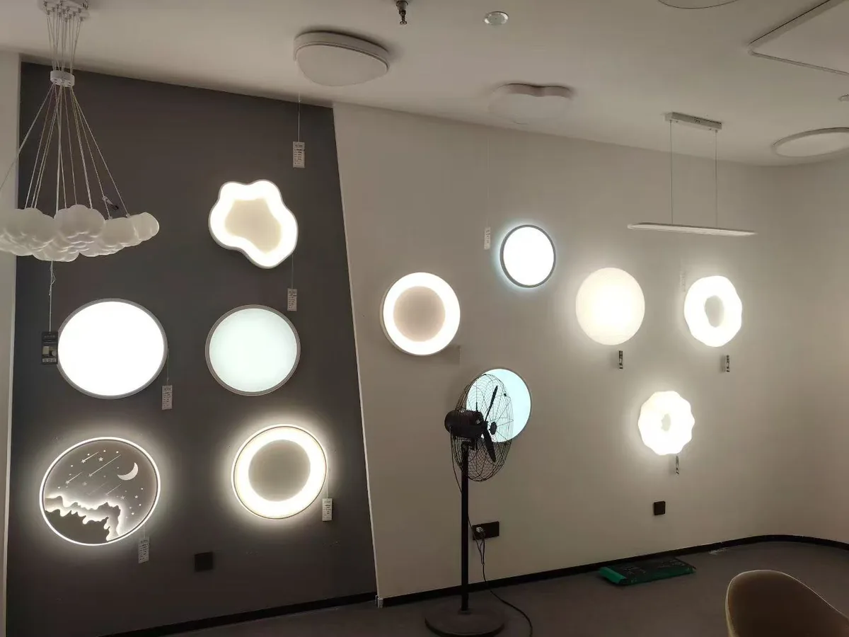 Wall display of ceiling light samples in partner showroom